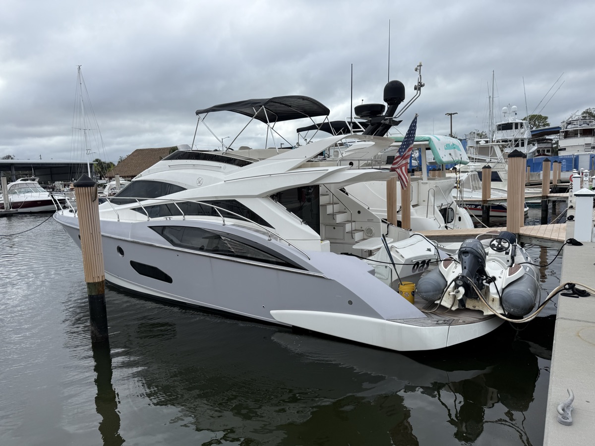 Yacht with American flag flying at the marina