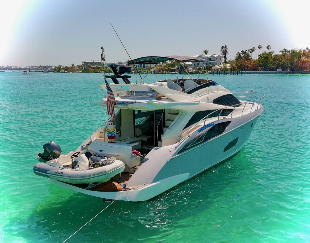 52ft Marquis yacht in crystal clear Bahamas turquoise water