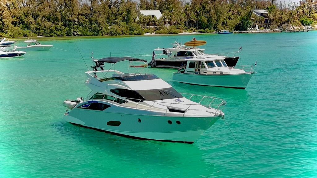 Luxury 52ft Marquis yacht anchored in turquoise waters near Tampa Bay Florida
